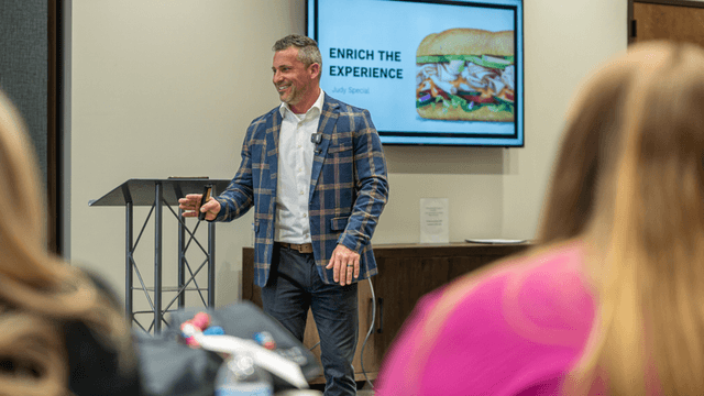 Brandon Matthews, founder of The Meaningful Marketplace, delivering a presentation focused on enriching workplace culture and employee engagement