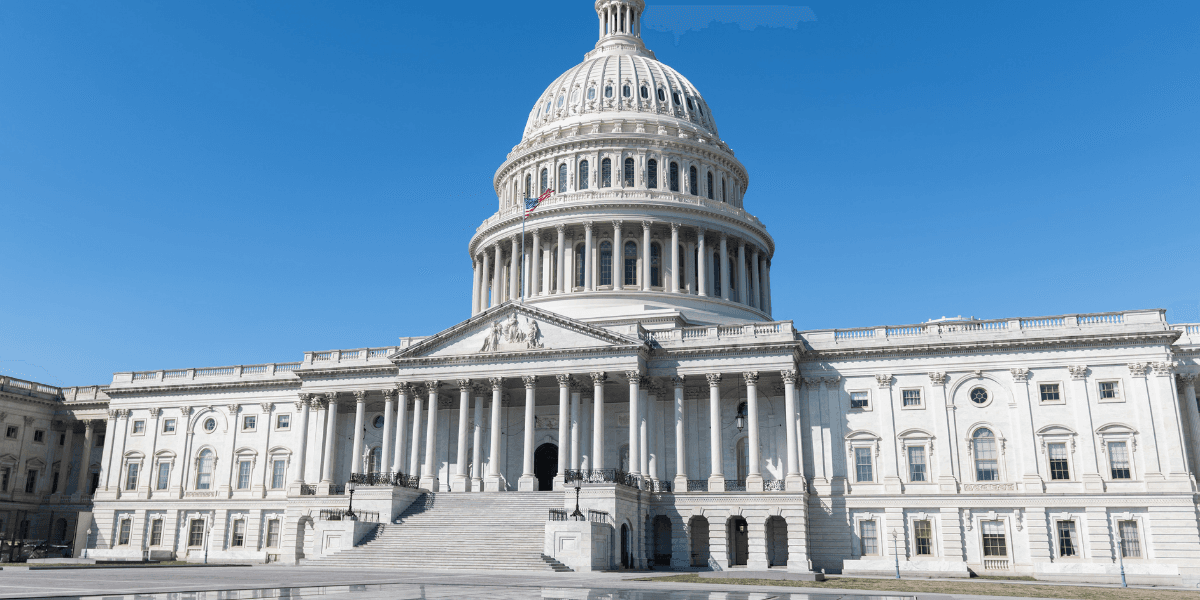 The U.S. Capitol building under a clear blue sky with no people present