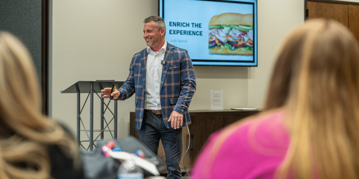 Brandon Matthews, founder of The Meaningful Marketplace, delivering a presentation focused on enriching workplace culture and employee engagement